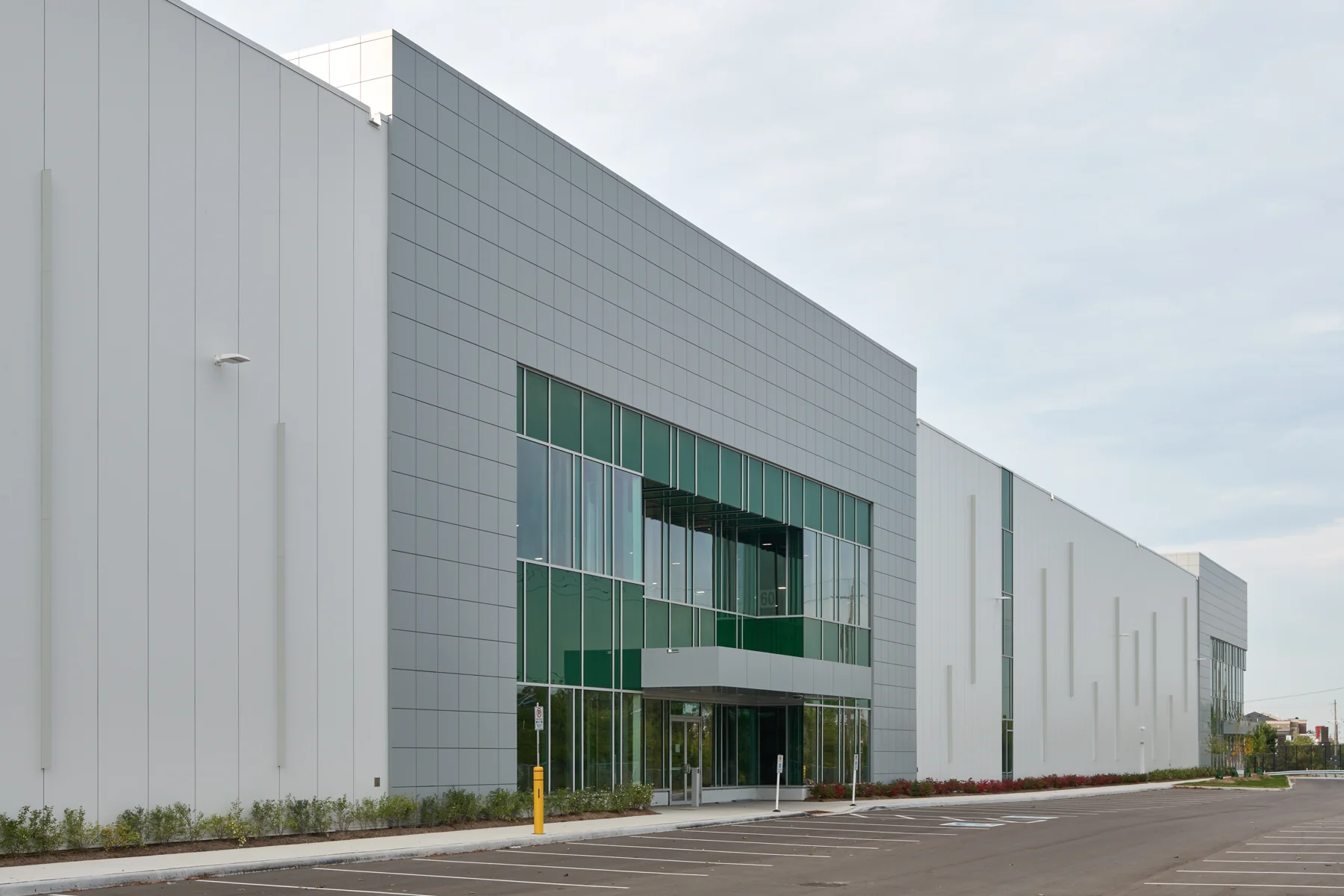 Insulated metal panel building showing panel joints and the glazed entrance